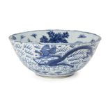 A rare and large Chinese porcelain bowl, Wanli period, painted in underglaze blue with a dragon