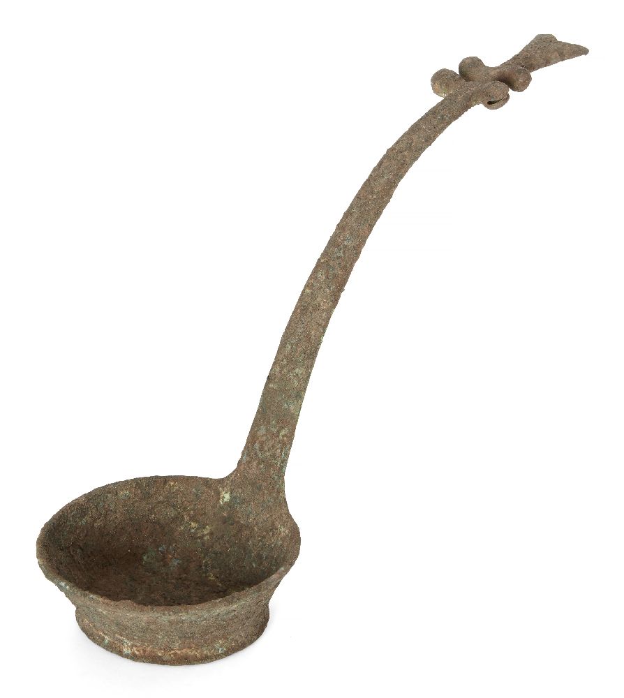 A Vietnamese bronze ritual ladle, Dong Son culture, ca. 2500BCE, the long tapering shaft cast with