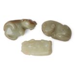 Three Chinese green jade cats, early 20th century, each carved in recumbent pose, 4.5cm - 5cmLight