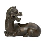 A Chinese bronze censer, Ming dynasty, 17th century, modelled as a recumbent kylin with its head