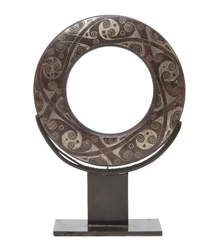 A Chinese bronze and silver-inlaid chariot fitting, Eastern Zhou dynasty, of flattened ring form,