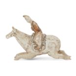 A Chinese miniature pottery figure of a polo player, Tang dynasty, in full gallop, painted in