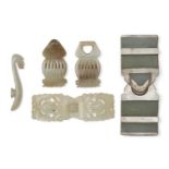 Three Chinese jade two-piece belt buckles and a garment hook, 18th-19th century, one of greenish-