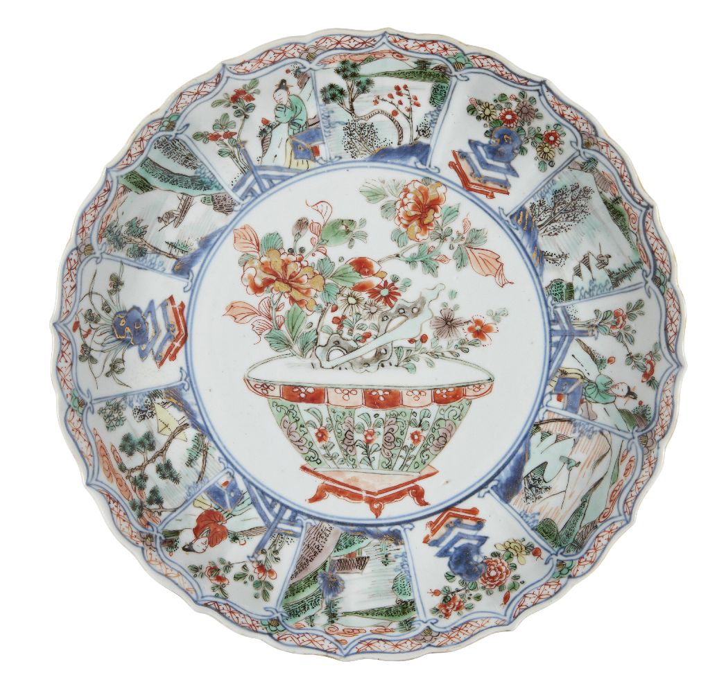 A Chinese porcelain moulded dish, Kangxi period, painted in famille verte enamels with a