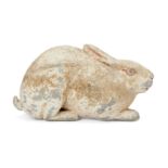 A Chinese grey pottery hare, Han dynasty, modelled crouching facing forwards in alert pose with long