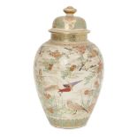 A Japanese Satsuma jar and cover, Meiji Period, of baluster form, decorated in all over flora and