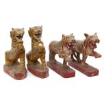 Four Burmese painted wood tigers, Tai Yai (Shan States), early 20th century, each roaring with paw