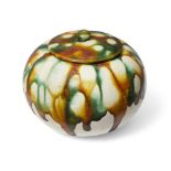 A Chinese sancai-glazed ovoid jarlet and cover, Tang dynasty, splashed to the cover and body in