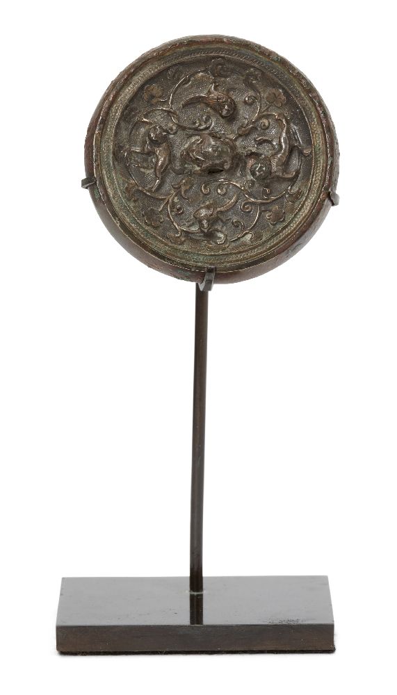 A Chinese miniature silver sheet-inlaid bronze circular mirror, Tang dynasty, the bronze mirror