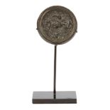A Chinese miniature silver sheet-inlaid bronze circular mirror, Tang dynasty, the bronze mirror