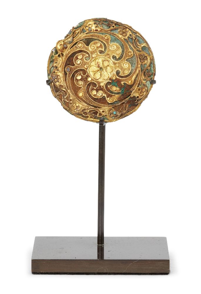 A Chinese bronze and gold circular plaque, Eastern Han dynasty, finely filigree and bead decorated