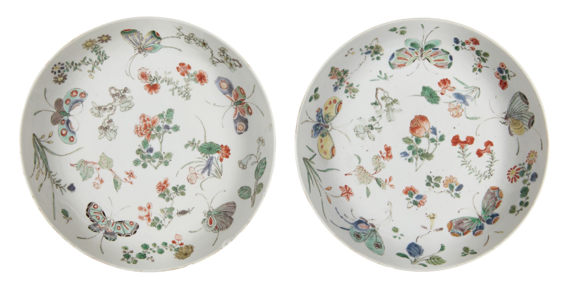 A pair of Chinese porcelain dishes, Kangxi period, painted in famille verte enamels with butterflies