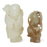 Two Chinese jade boy figures, 18th and 19th century, one of greenish-white tone finely carved as a