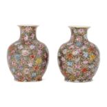 A pair of Chinese porcelain millefleurs vases, Republic period, painted in famille rose enamels with