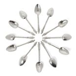 A set of twelve Chinese silver teaspoons, Wang Hing, with wrythen twist stems and cast with an