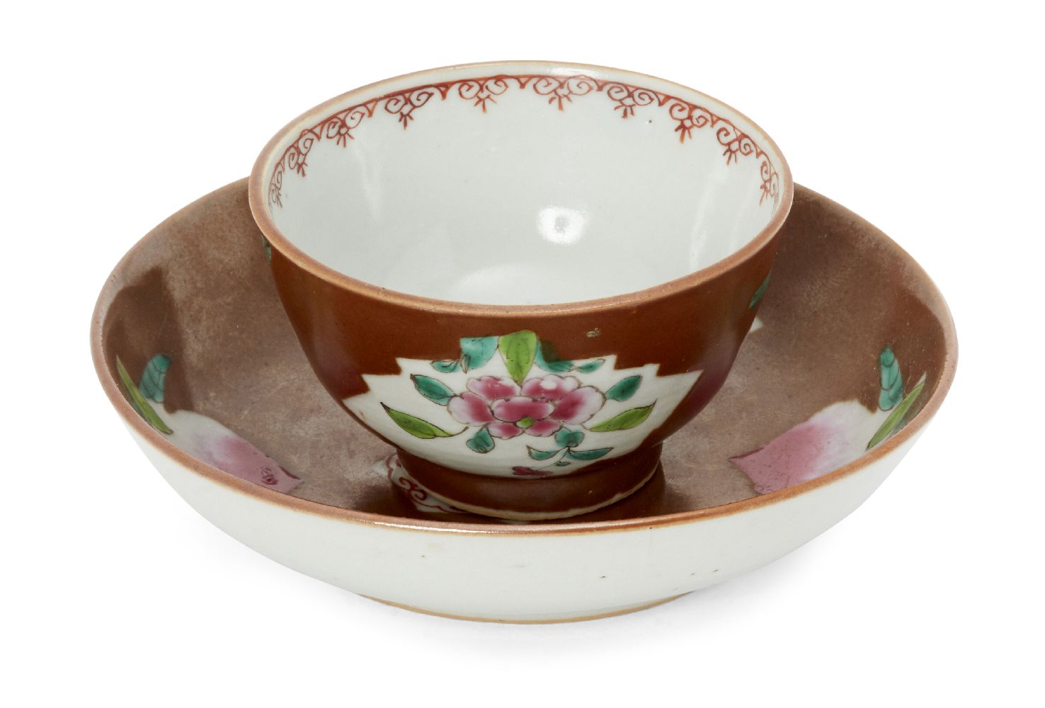 A Chinese porcelain sparrow-beak milk jug and a Batvian Ware cup and saucer, Qianlong period, each