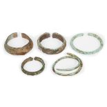 Five Chinese bronze bracelets, Neolithic period, three with woven decoration, 4cm - 6.5cm diameter