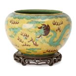 A Chinese porcelain 'dragon' sancai jardiniere, Republic period, painted with two dragons chasing