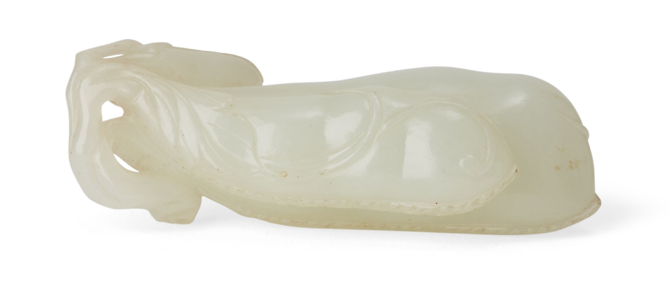 A Chinese greenish-white jade bean pendant, 18th/19th century, finely carved as a branch issuing