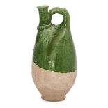 A Chinese pottery flask, Liao dynasty, modelled imitating a leather original, with an upright spout,