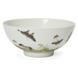 A Chinese porcelain bowl, Republic period, painted in famille rose enamels with butterflies flying