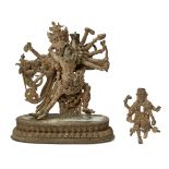 A Sino-Tibetan parcel gilt bronze figure of Chakrasamvara and Vajravarahi, 18th century, striding in