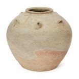 A large Chinese Yue-type pottery jar, Six Dynasties, with ash-glaze to the top half stopping above