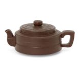 A Chinese Yixing teapot, 20th century, of compressed cylindrical form with moulded decoration to the