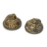 A rare pair of Chinese bronze and inlaid 'tiger' mat weights, Western Han dynasty, each finely