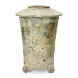 A Chinese pottery green-glazed granary jar, Han dynasty, the sloped cover incised with two chevron