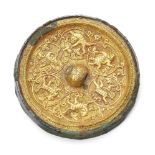 A rare Chinese bronze gold inlaid circular mirror, Tang dynasty, inlaid with a gold sheet finely