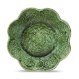 A Chinese green-glazed pottery 'lotus pond' lobed bowl, Liao dynasty, 10th/11th century, moulded
