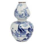 A Chinese porcelain double gourd vase, Republic period, painted in underglaze blue with a woman