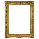 A Carved and Gilded Louis XV/Regence Transitional Frame, 19th century, with cavetto sight, stiff