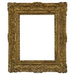 A Carved and Gilded Louis XIV Frame, with leaf sight, sanded frieze, the cross-hatched ogee with