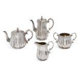 A Victorian four-piece silver tea set, London, c.1863, Edward & John Barnard, of lobed,