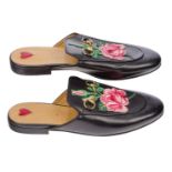 A pair of Gucci Women's Princetown leather slippers, designed in black leather, with horse bit