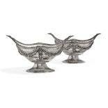 A pair of pierced silver oval baskets, London c.1891 and c.1900, C.S Harris & Sons, each of