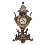 A Sevres style gilt-bronze mounted urn and cover, converted to a clock, late 19th century, the ovoid