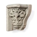A French sandstone capital, c.1500 style, carved and pierced with grapes and vine leaves, later