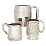 Two continental silver tankards, one of plain, barrel form with presentation engraving, stamped