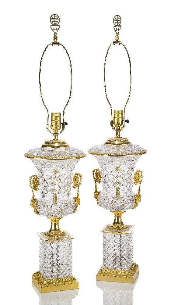 A pair of Empire style gilt-bronze and glass lamps, late 20th century, the glass bodies of urn