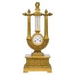A large French Empire style ormolu lyre clock, mid 19th century, the case surmounted by a female