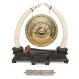 An Indian brass and ivory mounted dinner gong, early 20th century, the gong engraved Presented to
