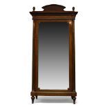 A French mahogany and gilt metal mounted mahogany wardrobe, 19th Century, the rectangular cavetto-