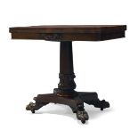 A Regency rosewood card table, the fold over top enclosing circular green baize lined playing