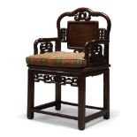 A Chinese hardwood armchair, second half 20th Century, the pierced back centred by plain rectangular