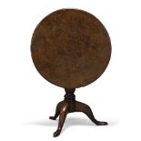 A George III pollard oak tilt top occasional table, the circular top above bird cage action, on