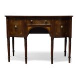 A George III mahogany and inlaid sideboard, with single frieze drawer flanked by two deep drawers,