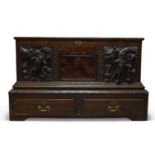 A Continental oak and inlaid coffer, 18th Century, the hinged lid enclosing storage space, the